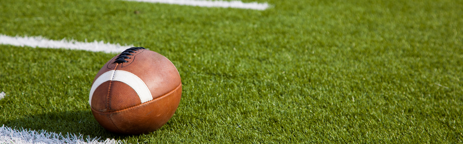 Football on green field